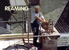 Reaming: one of our team working on a chimney from a rooftop platform